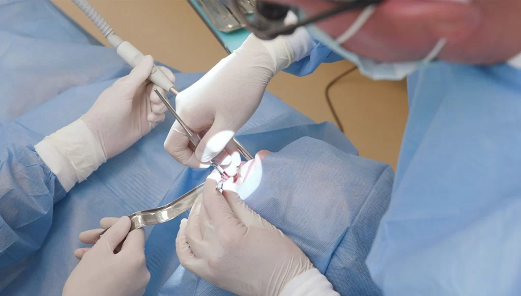 Oral Surgeon working on patient