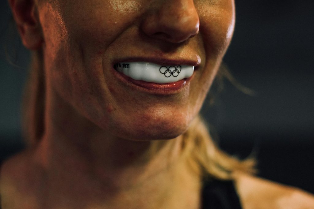 woman wearing an olympic themed mouth guard