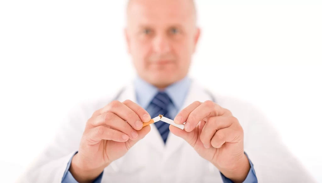 doctor breaking a cigarette in half