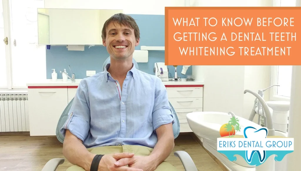 young man smiling while sitting in dentist chair.