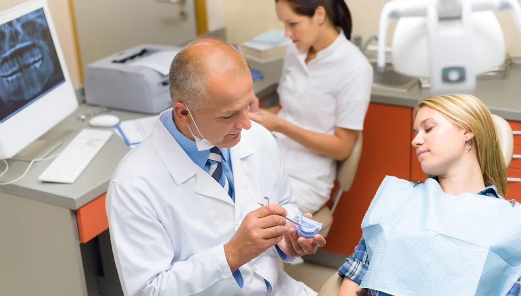 dentist discussing dental issues with his patient