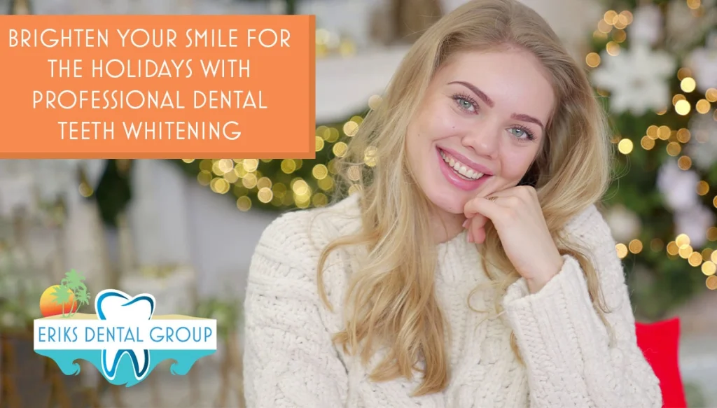 young woman infront on Christmas ornaments smiling