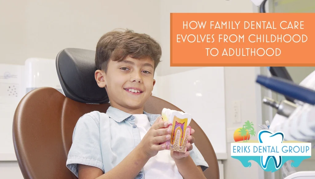 a young boy holding a model of a tooth
