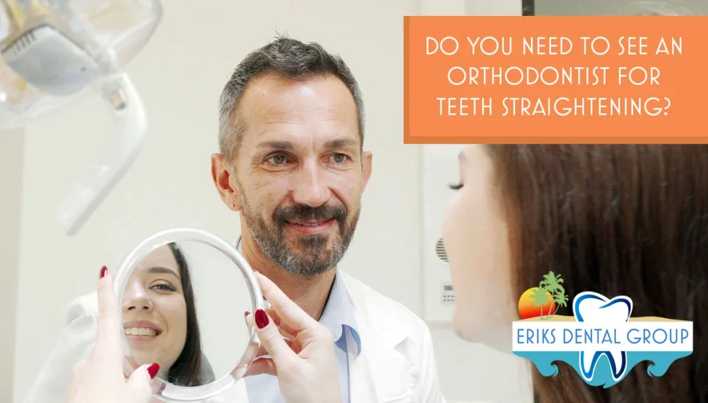 dentist watching patient examine her smile in the handheld mirror