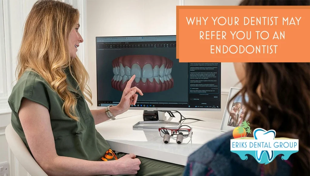 dentist pointing at screen of a 3D model of teeth